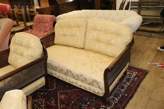 A mahogany and double canework bergere suite Sofa W.145cm